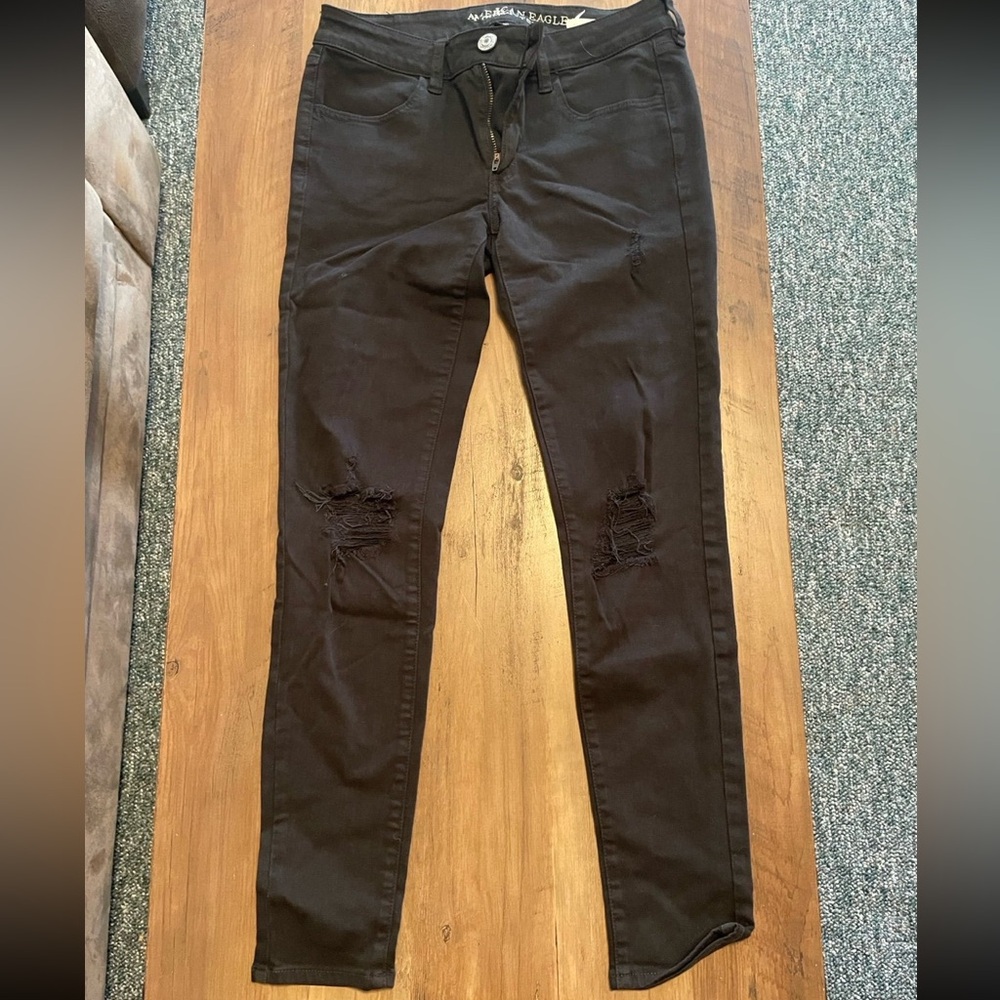 American Eagle super stretch black distressed jeggings. Size 6.